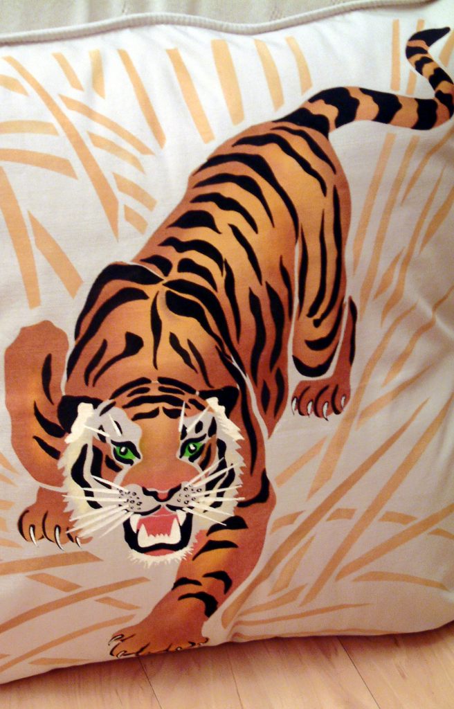 Large Crouching Tiger and Grass motif
4 sheet tiger and grasses stencil
© Henny Donovan Motif
Our fantastic tiger stencil - the Large Tiger Stencil - shows this animal's amazing rippling strength, movement and drama. Use it to add real impact to a decorative feature mural or on fabric and cushion covers. Stencil in bold 'tiger' colours, as here, or try a more sophisticated and oriental effect with gold leaf!

Four sheet stencil containing a three layer tiger motif and extra grass motif. See size and layout specifications below.